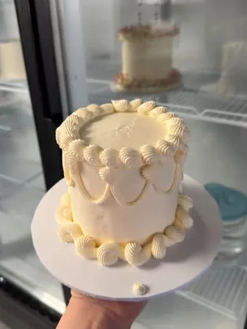 Ivory vintage mini cake with piped swags and shell borders
